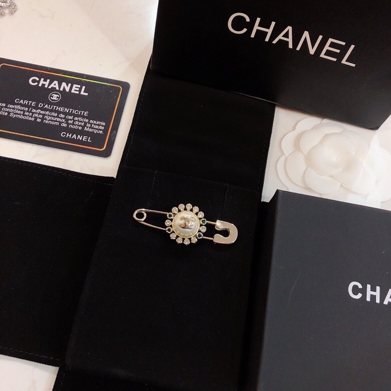 Ch*el brooches